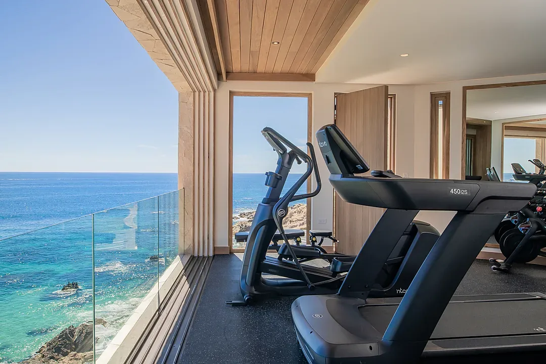 The gym at Villa Lazul, glass to the sea
