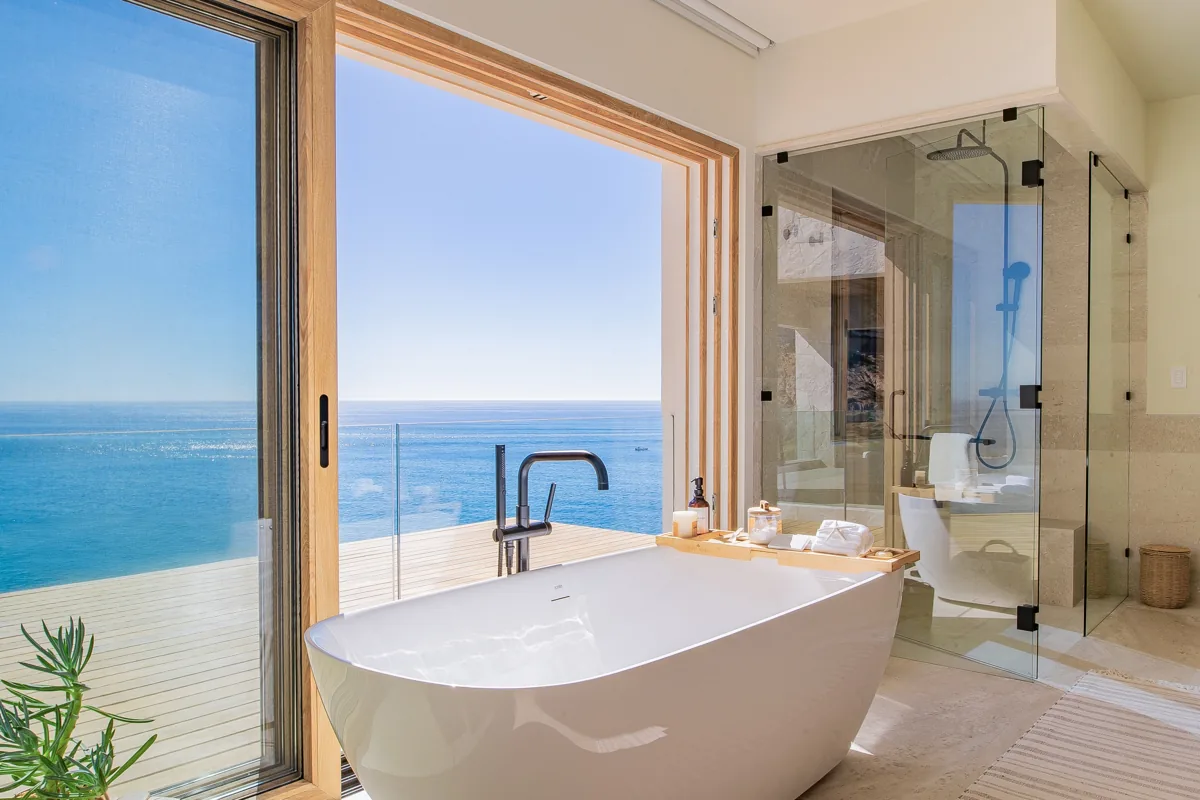 Primary bath with freestanding tub over the sea